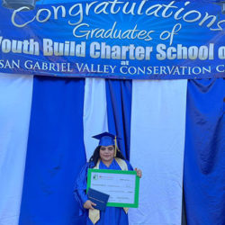 Young female graduate holding her diploma
