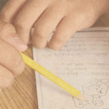 Student hands doing homework